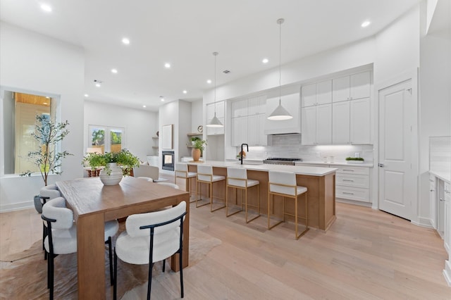 432 W 24th St, Houston, TX 77008 - dining room featuring light wood-type flooring and recessed lighting