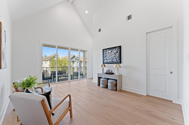432 W 24th St, Houston, TX 77008 - sitting room with high vaulted ceiling, light wood-style floors, baseboards, and beam ceiling