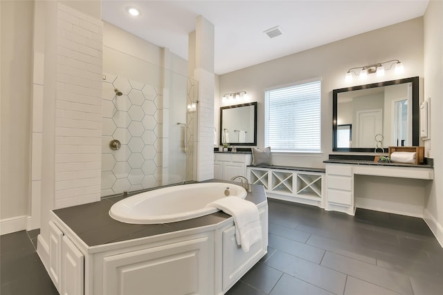18115 Bachman Branch Dr, Cypress, TX 77433 - bathroom with walk in shower, a bath, tile patterned floors, and vanity