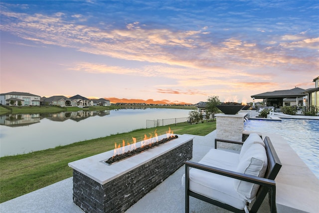 18115 Bachman Branch Dr, Cypress, TX 77433 - view of patio featuring a water view and an outdoor living space with a fire pit