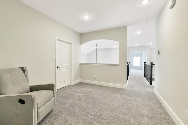 18115 Bachman Branch Dr, Cypress, TX 77433 - unfurnished room featuring carpet, baseboards, arched walkways, recessed lighting, and an upstairs landing