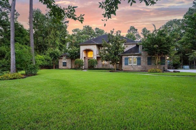 10250 Clubhouse Cir, Magnolia, TX 77354 - view of front facade featuring a yard, brick siding, and roof with shingles