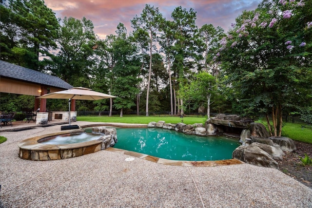 10250 Clubhouse Cir, Magnolia, TX 77354 - view of pool featuring a patio, view of wooded area, and a pool with connected hot tub