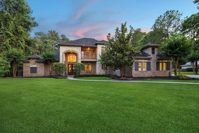 10250 Clubhouse Cir, Magnolia, TX 77354 - french provincial home featuring a balcony, a lawn, and brick siding