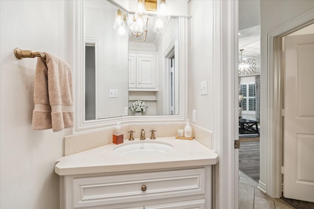 10250 Clubhouse Cir, Magnolia, TX 77354 - bathroom featuring a chandelier, vanity, and tile patterned flooring