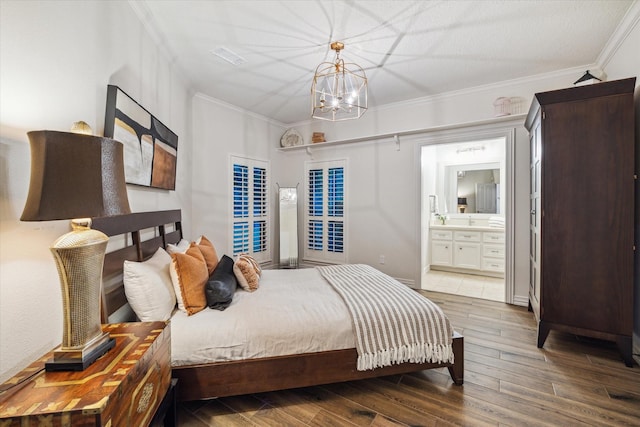 10250 Clubhouse Cir, Magnolia, TX 77354 - bedroom featuring a chandelier, wood finished floors, crown molding, and connected bathroom