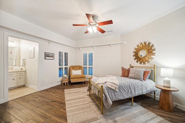 10250 Clubhouse Cir, Magnolia, TX 77354 - bedroom featuring wood finished floors, ornamental molding, ensuite bath, a ceiling fan, and baseboards