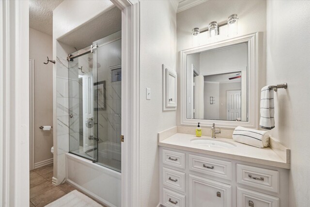 10250 Clubhouse Cir, Magnolia, TX 77354 - bathroom featuring toilet, vanity, bath / shower combo with glass door, and tile patterned flooring
