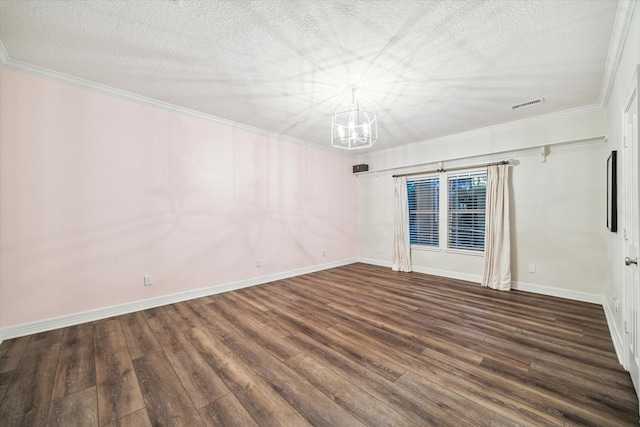10250 Clubhouse Cir, Magnolia, TX 77354 - empty room featuring a chandelier, dark wood finished floors, baseboards, crown molding, and a textured ceiling