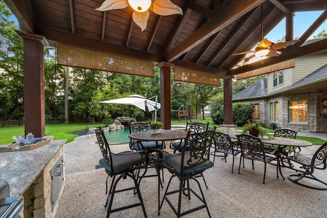 10250 Clubhouse Cir, Magnolia, TX 77354 - view of patio / terrace with outdoor dining area, ceiling fan, and a playground