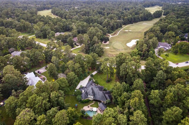 10250 Clubhouse Cir, Magnolia, TX 77354 - aerial view of property and surrounding area with a local golf course and a heavily wooded area