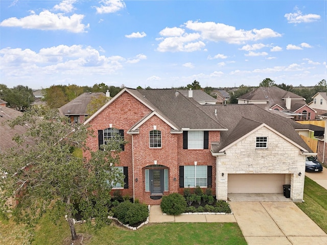 13909 Stonewood Ct, Rosharon, TX 77583 - view of front of house with concrete driveway, a shingled roof, a residential view, stone siding, and brick siding