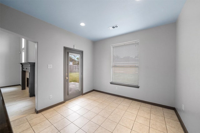 13909 Stonewood Ct, Rosharon, TX 77583 - unfurnished room featuring baseboards, recessed lighting, and light tile patterned floors
