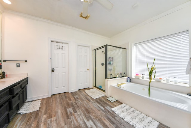23214 Gatecreek Ct, Katy, TX 77494 - full bathroom with crown molding, a shower stall, a garden tub, wood finished floors, and vanity