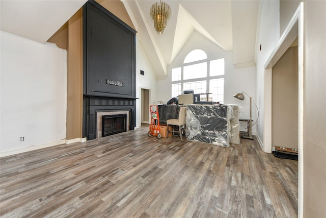 23214 Gatecreek Ct, Katy, TX 77494 - living room featuring wood finished floors, high vaulted ceiling, and a fireplace