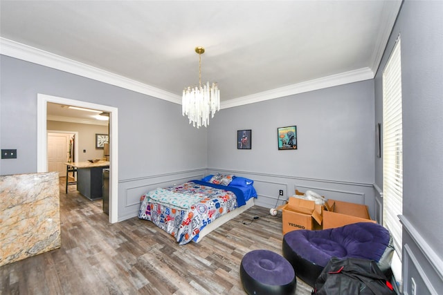 23214 Gatecreek Ct, Katy, TX 77494 - bedroom with crown molding, wood finished floors, and a chandelier