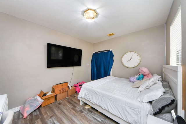 23214 Gatecreek Ct, Katy, TX 77494 - bedroom with wood finished floors and multiple windows