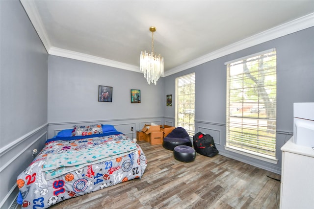 23214 Gatecreek Ct, Katy, TX 77494 - bedroom with crown molding, a chandelier, wood finished floors, and a wainscoted wall