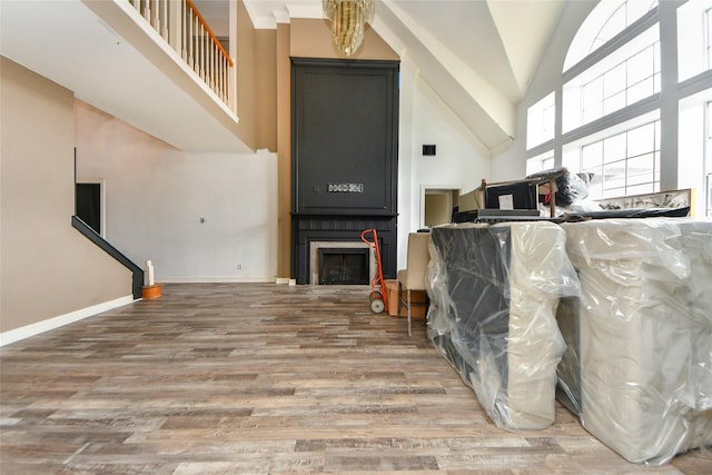23214 Gatecreek Ct, Katy, TX 77494 - living room featuring high vaulted ceiling, wood finished floors, and baseboards