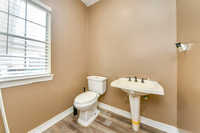 23214 Gatecreek Ct, Katy, TX 77494 - half bath featuring toilet, wood finished floors, and baseboards