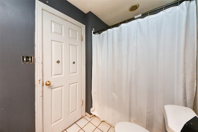 23214 Gatecreek Ct, Katy, TX 77494 - full bathroom with toilet, tile patterned flooring, and a shower with curtain