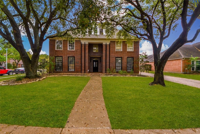 23214 Gatecreek Ct, Katy, TX 77494 - colonial house with brick siding and a front lawn