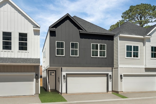 5832 Highland Sun Ln, Houston, TX 77091 - view of front of home featuring a shingled roof, board and batten siding, and a garage