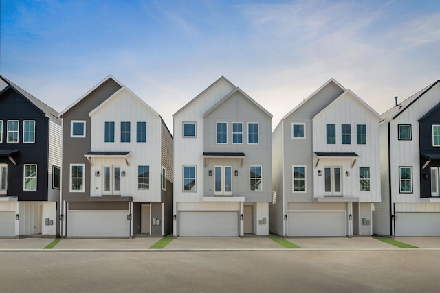 5832 Highland Sun Ln, Houston, TX 77091 - view of property featuring an attached garage and board and batten siding