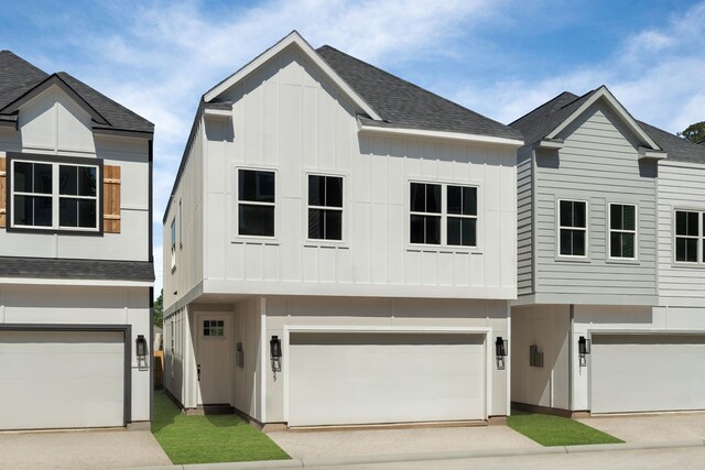 5835 Highland Sun Ln, Houston, TX 77091 - view of front of property featuring board and batten siding, a garage, concrete driveway, and roof with shingles