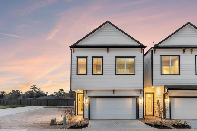 5833 Highland Sun Ln, Houston, TX 77091 - view of front of home with a garage and concrete driveway