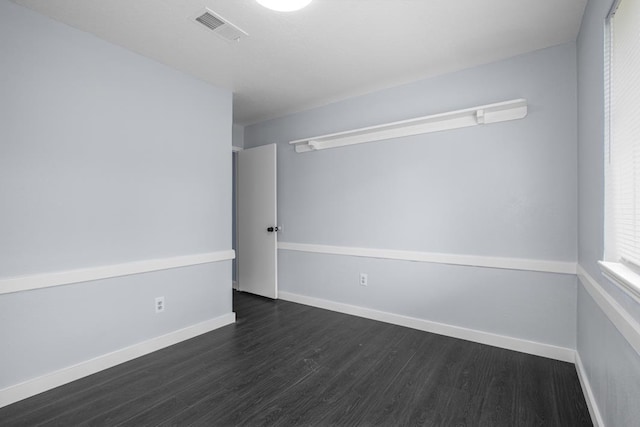 10603 Zircon Ct, Houston, TX 77099 - empty room featuring dark wood-style floors and baseboards