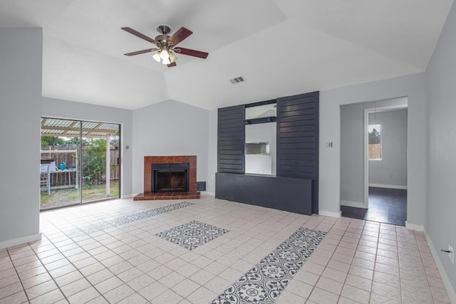 10603 Zircon Ct, Houston, TX 77099 - unfurnished living room featuring tile patterned floors, vaulted ceiling, plenty of natural light, ceiling fan, and a fireplace