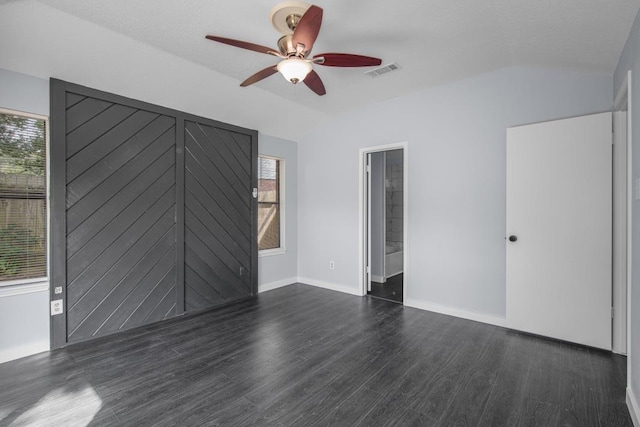 10603 Zircon Ct, Houston, TX 77099 - empty room featuring dark wood finished floors, lofted ceiling, a ceiling fan, and baseboards