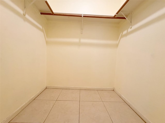 8631 Mapletwist St, Houston, TX 77083 - walk in closet with light tile patterned floors