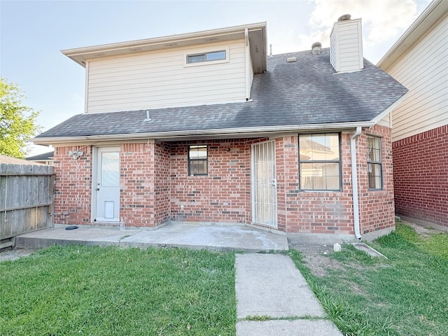 8631 Mapletwist St, Houston, TX 77083 - back of house with brick siding, a shingled roof, and a chimney