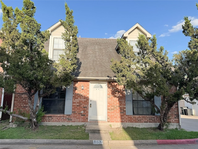 8631 Mapletwist St, Houston, TX 77083 - view of front of home with a shingled roof and brick siding