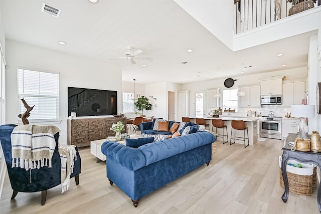 4101 5th St, Galveston, TX 77554 - living room with a ceiling fan, light wood-style floors, and recessed lighting