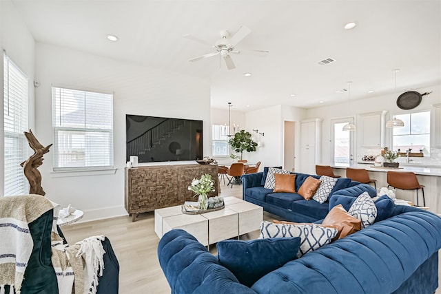 4101 5th St, Galveston, TX 77554 - living room featuring healthy amount of natural light, light wood-style floors, a ceiling fan, recessed lighting, and baseboards
