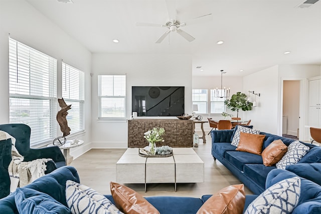 4101 5th St, Galveston, TX 77554 - living room featuring a chandelier, ceiling fan, recessed lighting, light wood-type flooring, and baseboards