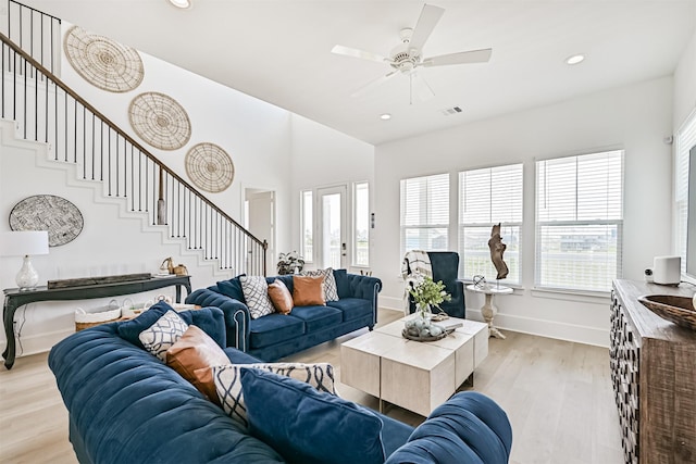 4101 5th St, Galveston, TX 77554 - living area featuring stairway, light wood-type flooring, baseboards, a ceiling fan, and recessed lighting