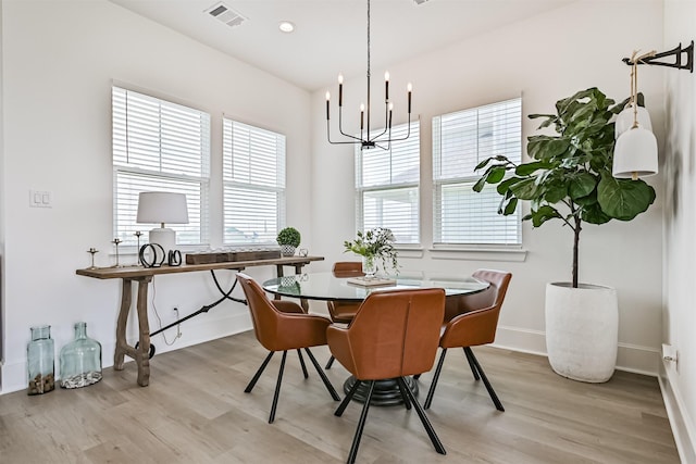 4101 5th St, Galveston, TX 77554 - dining room with light wood-style flooring, a chandelier, healthy amount of natural light, and recessed lighting
