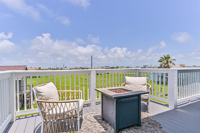 4101 5th St, Galveston, TX 77554 - wooden deck with an outdoor fire pit and a yard