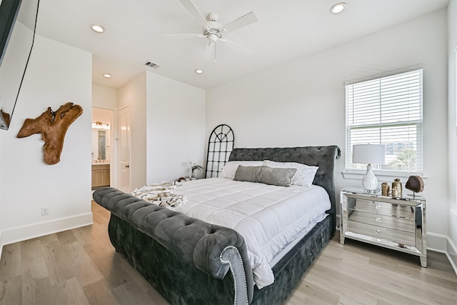 4101 5th St, Galveston, TX 77554 - bedroom with wood finished floors, baseboards, recessed lighting, and ensuite bath