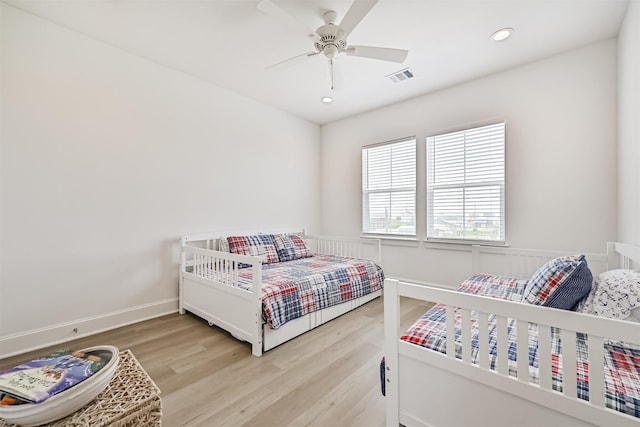 4101 5th St, Galveston, TX 77554 - bedroom with light wood finished floors, recessed lighting, ceiling fan, and baseboards
