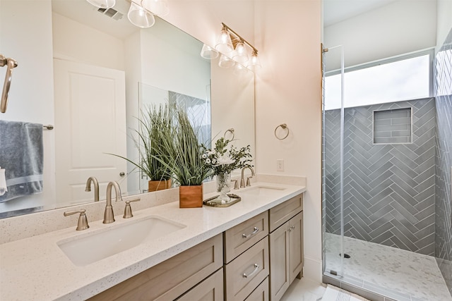 4101 5th St, Galveston, TX 77554 - full bath with double vanity, a stall shower, and marble look tiles