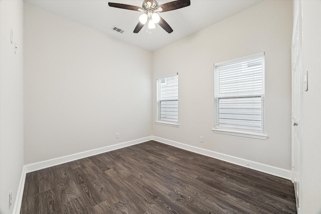 314 E 40th St, Houston, TX 77018 - unfurnished room with dark wood-style flooring, a ceiling fan, and baseboards