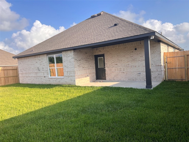 15826 Sugar Maple Ln, Santa Fe, TX 77517 - rear view of house with brick siding, roof with shingles, a patio, and a gate