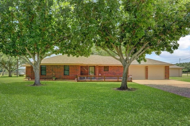 13302 Kettler Rd, Needville, TX 77461 - single story home with driveway, a front lawn, an attached garage, and brick siding