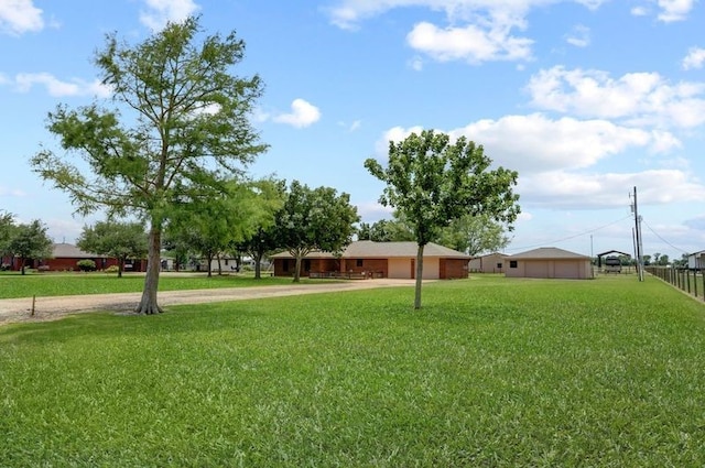 13302 Kettler Rd, Needville, TX 77461 - view of yard with dirt driveway and an attached garage