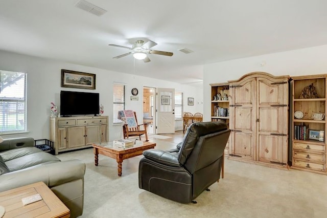 13302 Kettler Rd, Needville, TX 77461 - living area with a ceiling fan and light colored carpet